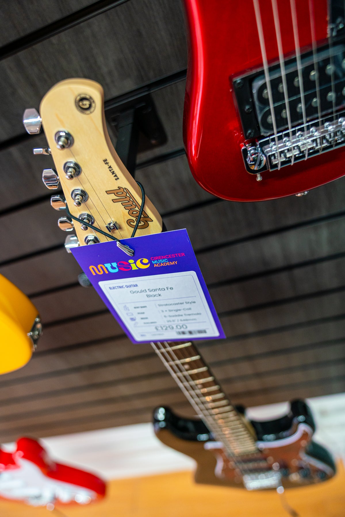 Electric guitar headstock and price tag in the Cirencester Music Academy shop