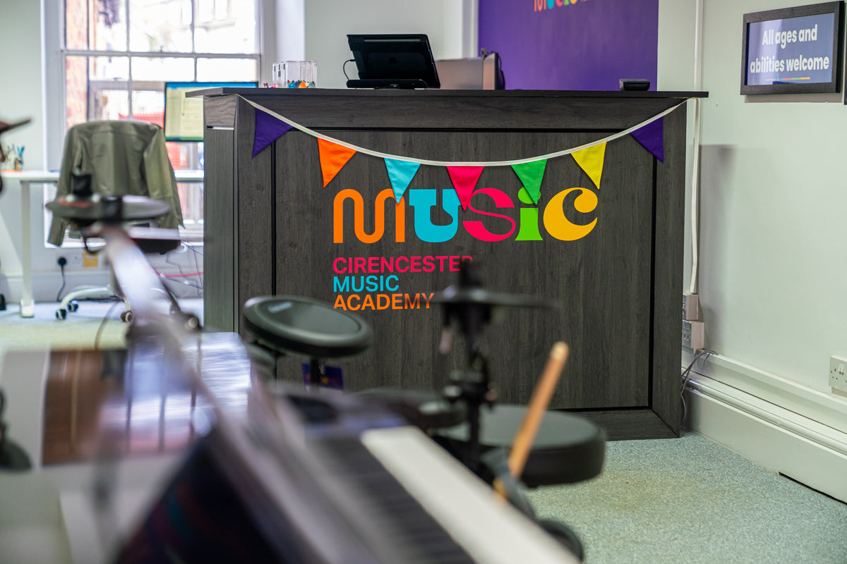 Cirencester Music Academy shop counter decorated with colourful bunting